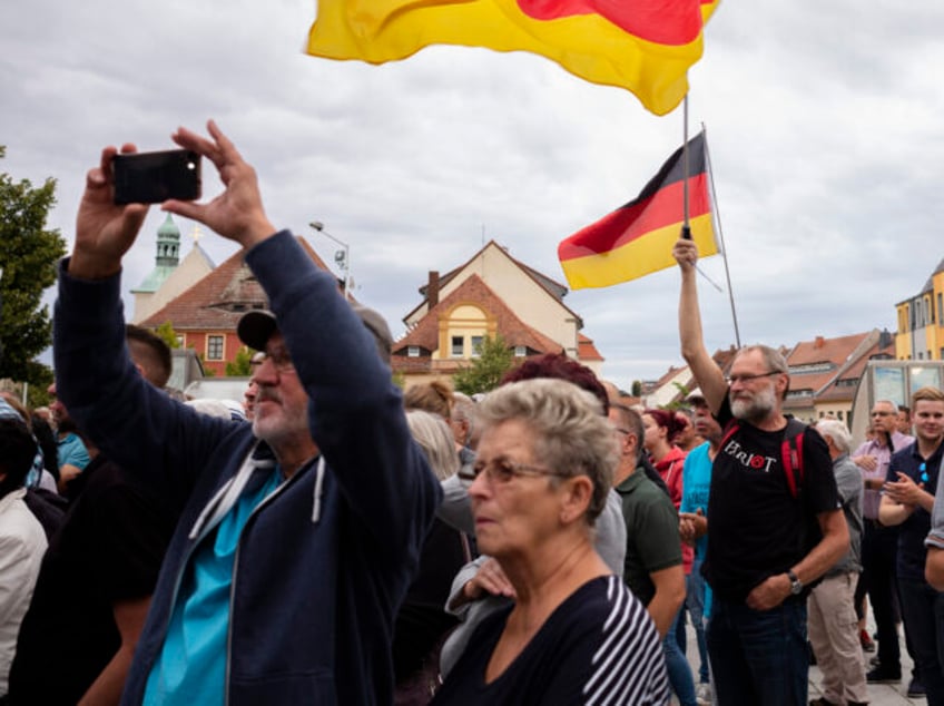 FILE - In this Thursday, Aug. 15, 2019 file photo, people attend an election rally of the