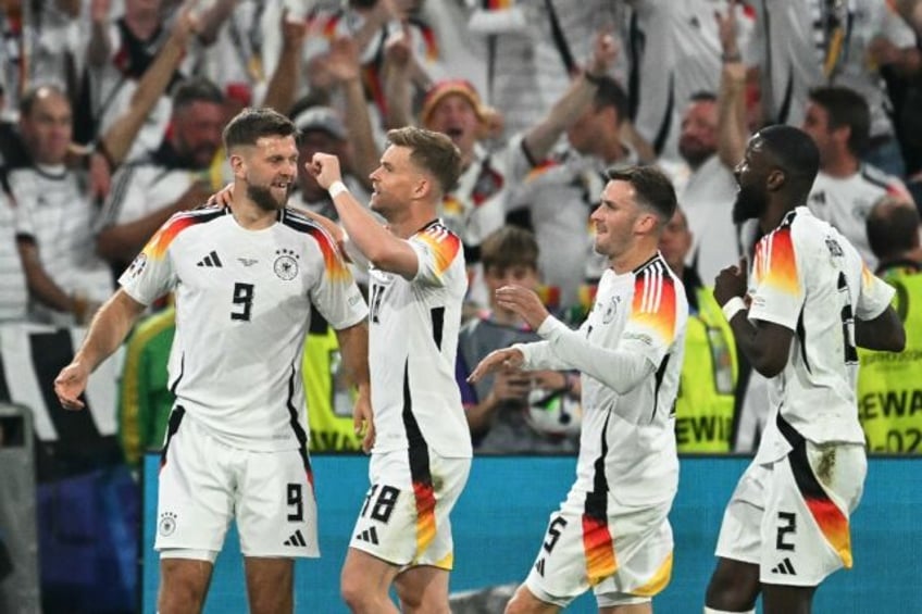 It was a night of celebration for Niclas Fuellkrug (L) and his Germany teammates