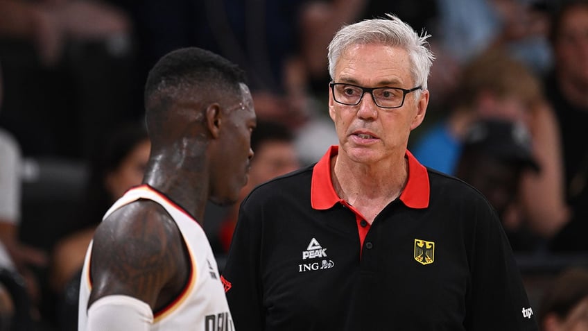 germany head coach tries to grab raptors dennis schroder in heated altercation at fiba world cup