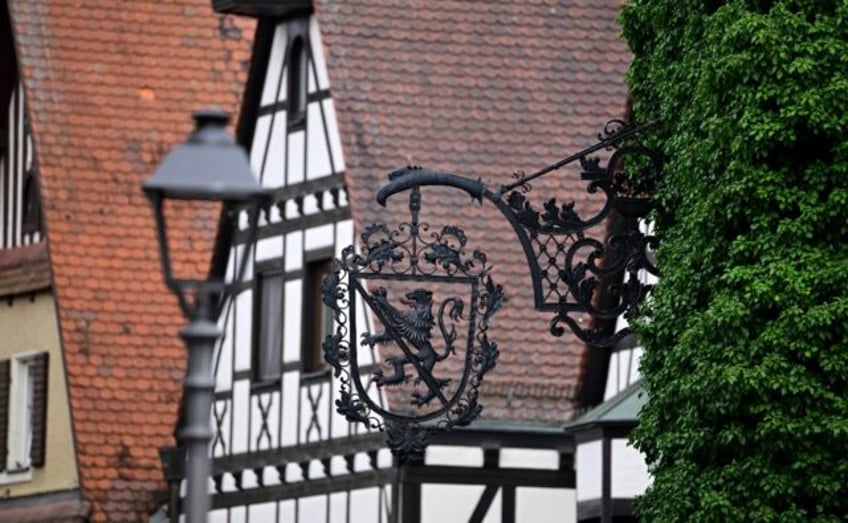 A sign with the lion, part of the coat of arms of Bavaria, is seen on a traditional half-t