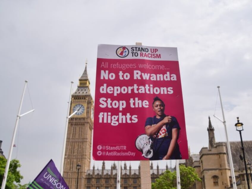 LONDON, UNITED KINGDOM - 2022/06/18: A placard opposing the deportation of refugees to Rwa