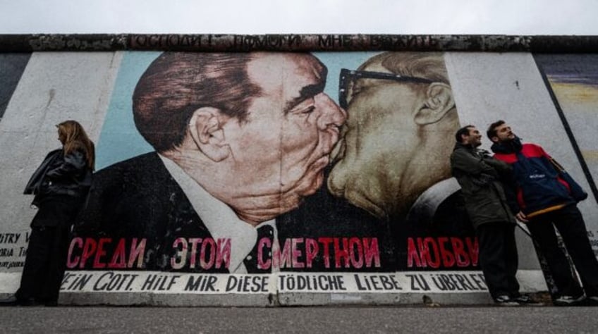 Dmitri Vrubel's mural depicting Soviet leader Leonid Brezhnev (L) and E. German counterpar