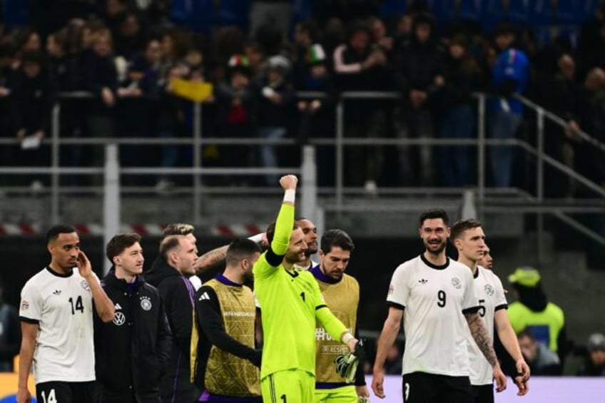 Germany goalkeeper Oliver Baumann celebrates with team-mates after winning the Nations Lea