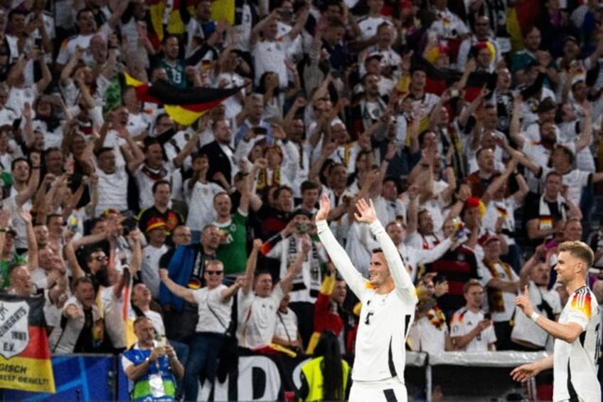 Germany players acknowledge the fans in the stadium at the end of their 5-1 win against Sc