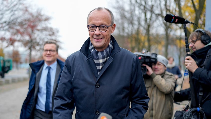 Friedrich Merz walking outside 