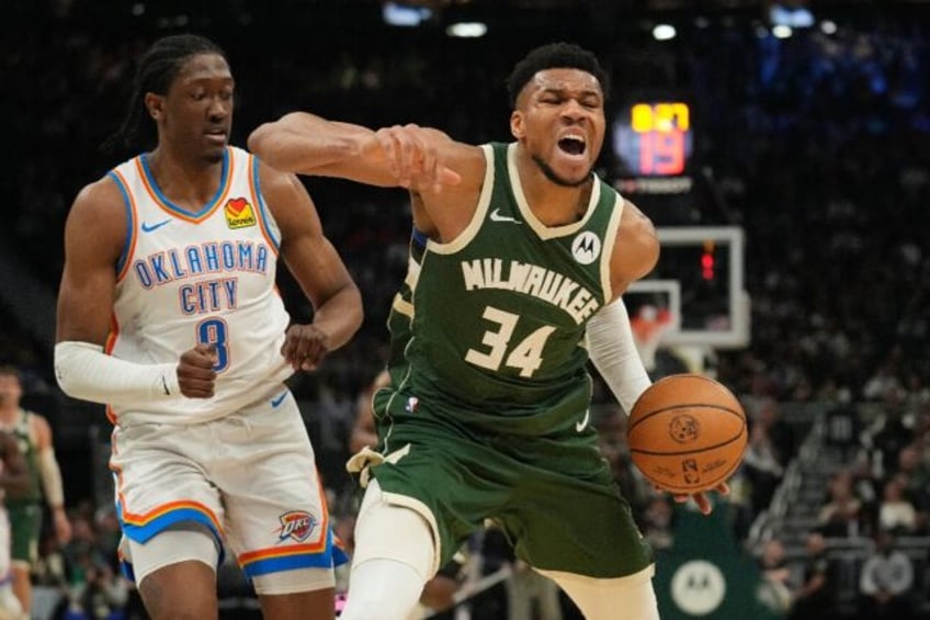 Milwaukee's Giannis Antetokounmpo, reacting to a foul by Oklahoma City's Jalen Williams, s