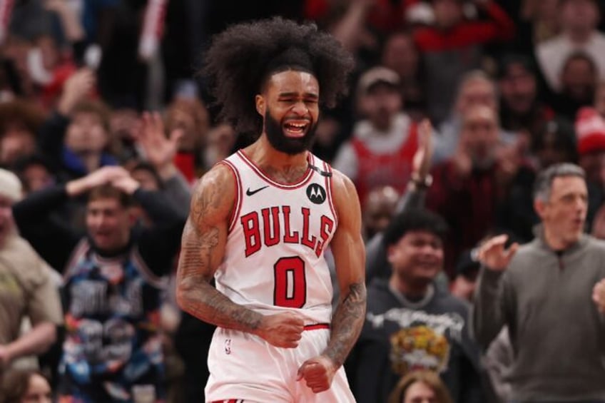 Chicago's Coby White celebrates a dunk in the Bulls' NBA victory over the San Antonio Spur