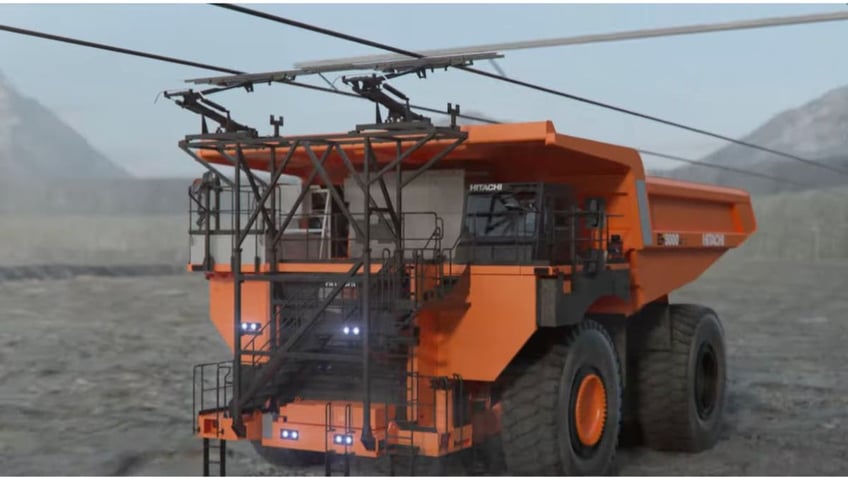 Giant battery-powered dump truck dumps diesel for electric