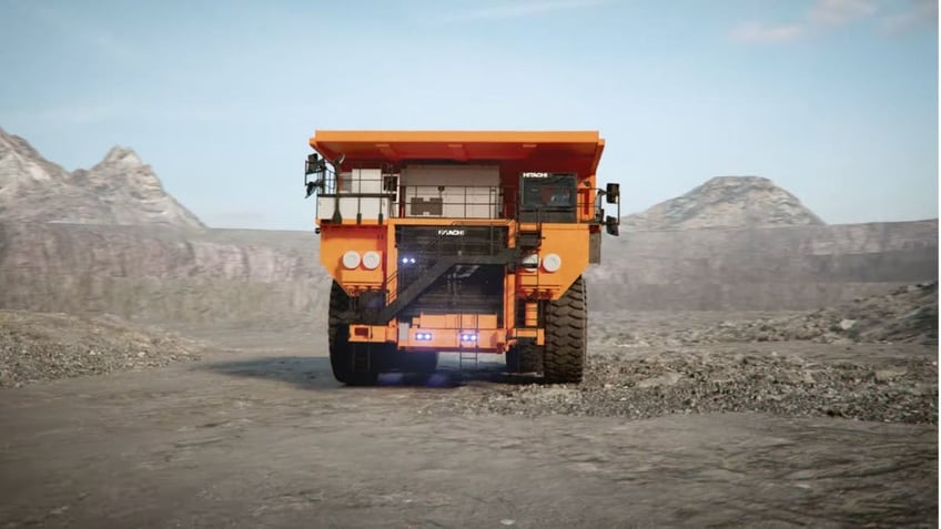 Giant battery-powered dump truck dumps diesel for electric