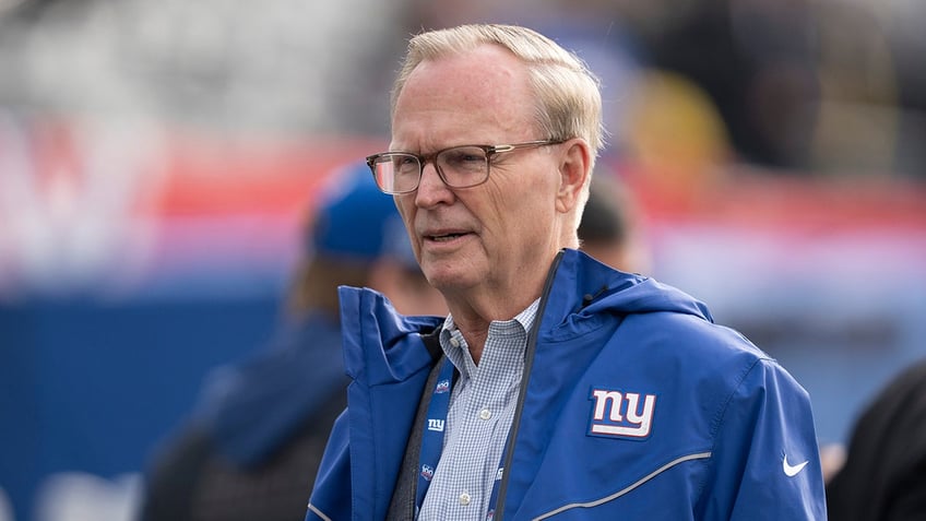 John Mara looks on