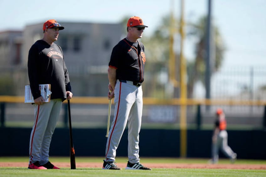 Pitching coach Bryan Price and manager Bob Melvin of the San Francisco Giants watch live batting practice during the San Francisco Giants Spring...