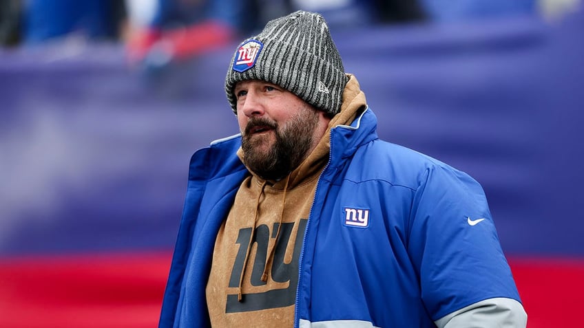 Brian Daboll looks on field