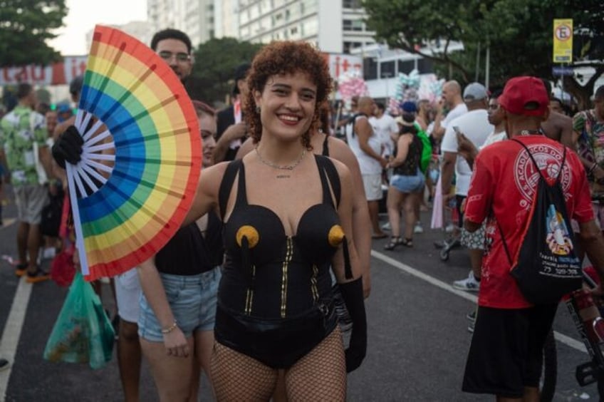 Fans arrive at Copacabana beach for a free concert by Madonna in Rio de Janeiro