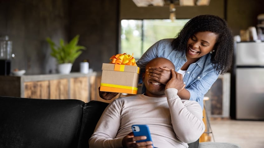 man being given present