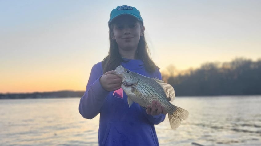 Lucy-holding-fish-with-spiky-spine