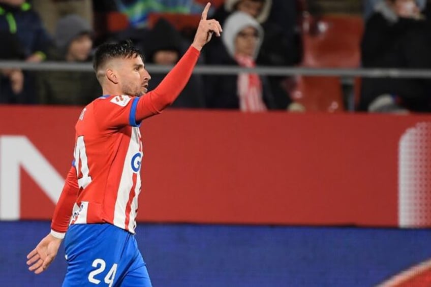 Cristian Portu celebrates scoring the winner for Girona against Osasuna