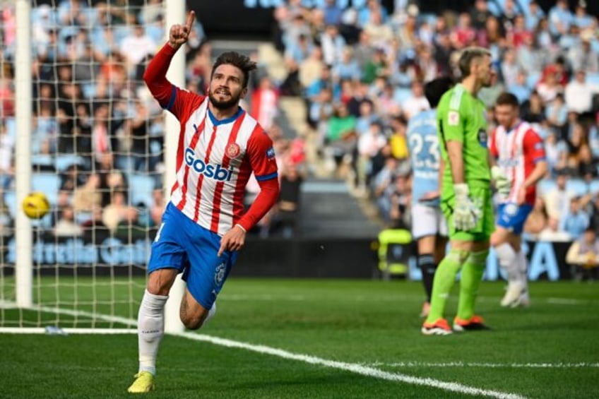 Girona forward Portu celebrates after scoring his team's winning goal at Celta Vigo which sent the Catalans top again