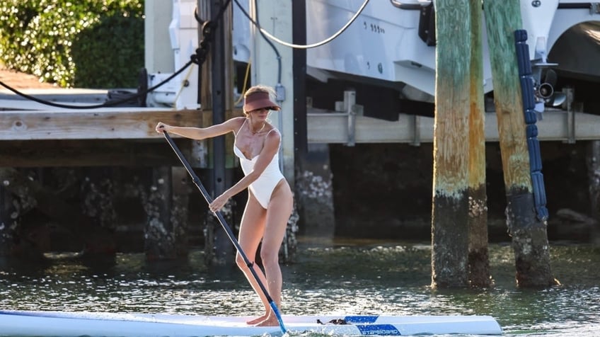 Gisele Bundchen paddle-boarding