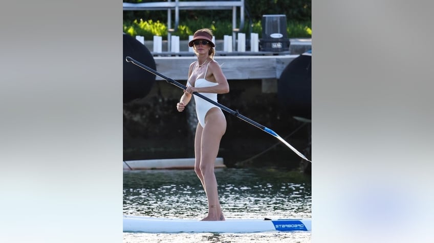Gisele Bundchen paddle-boarding