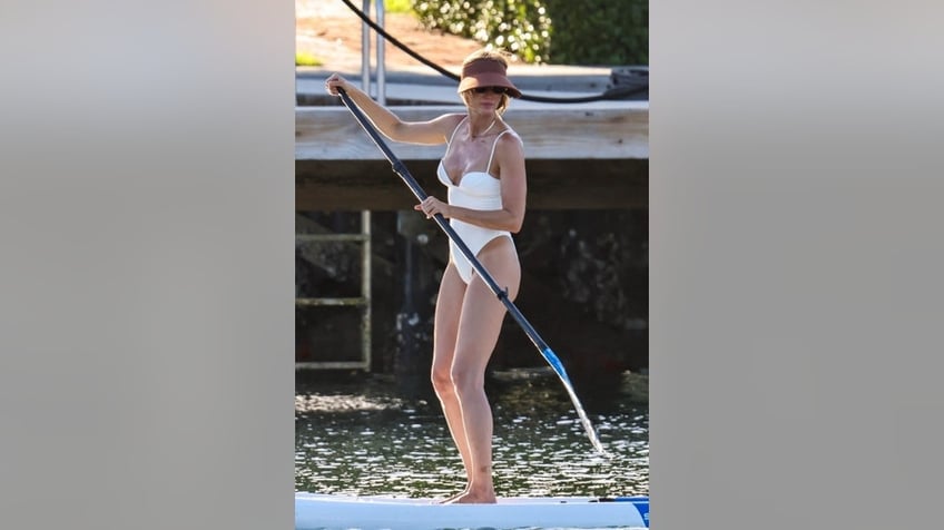 Gisele Bundchen paddle-boarding
