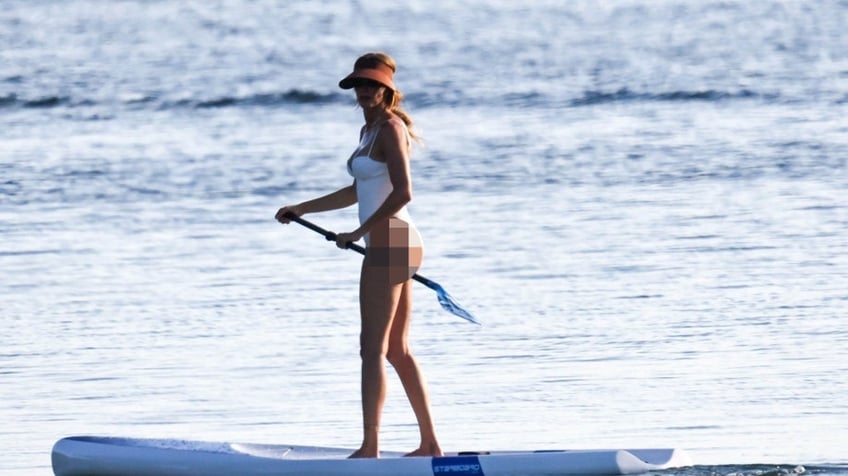 Gisele on a paddle board