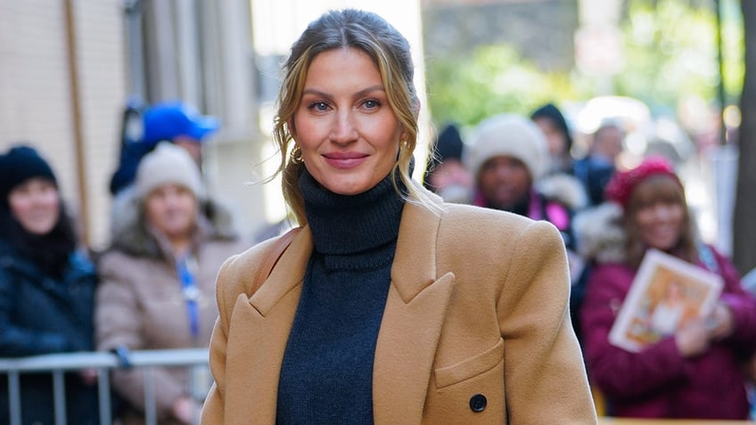 Gisele Bundchen wearing a coat