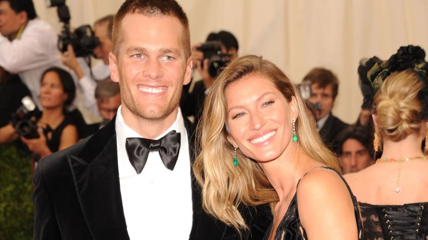 Tom Brady and Gisele smile for a photo