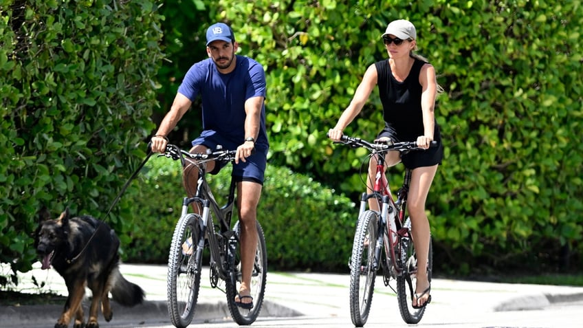 Joaquim Valente and Gisele ride bikes