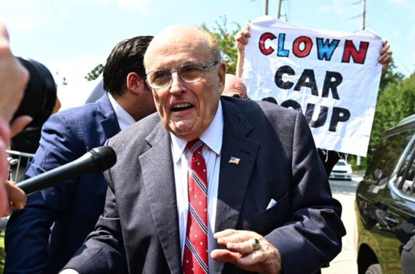 giuliani booked in georgia election case calls charges a travesty