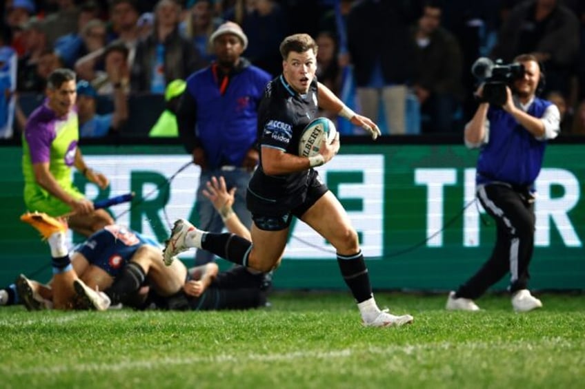 Glasgow Warriors centre Huw Jones scores the try that won the United Rugby Championship fi