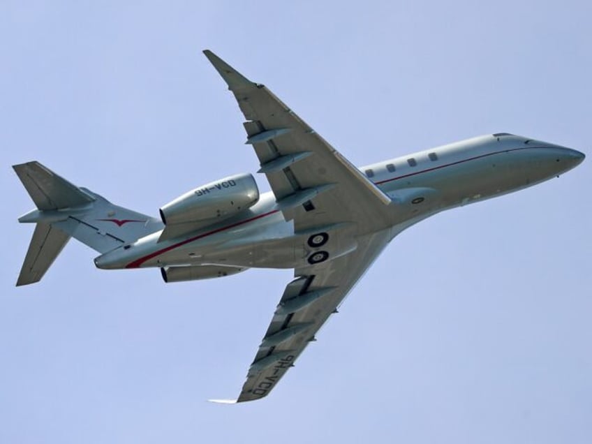 Bombardier Challenger 350, from Vistajet company, is taking off from Barcelona airport, in