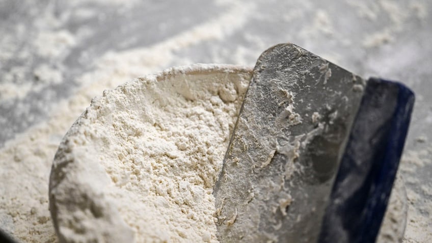 Dough divider in a bowl of flour