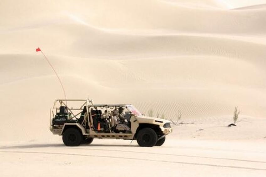 gm defenses new infantry squad vehicle passes grueling sand dune trials in uae