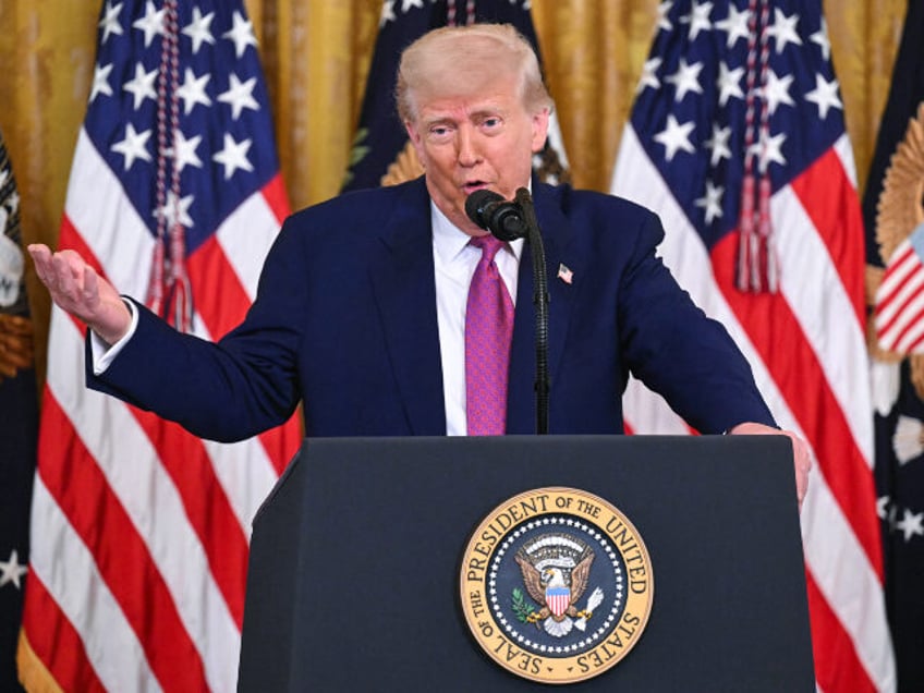 US President Donald Trump speaks before signing a bill blocking California's rule ban