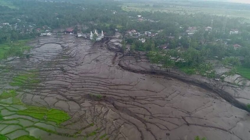 Hours of heavy rain and cold lava from nearby volcano Mount Marapi inundated two districts