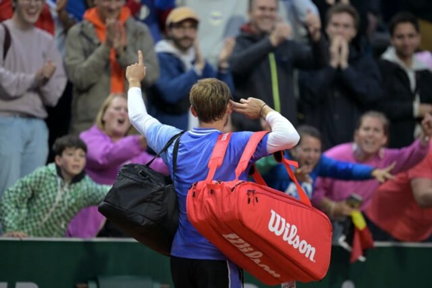 'Ridiculous': David Goffin cups his ear to the crowd after defeating France's Giovanni Mpe