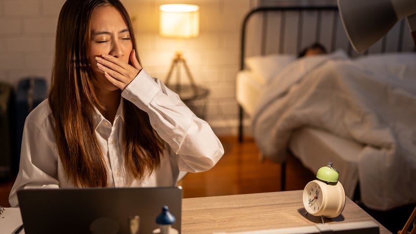 Woman yawning