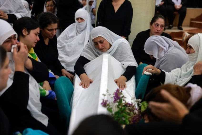 Druze mourners in Majdal Shams after deadly rocket fire at the Golan Heights town