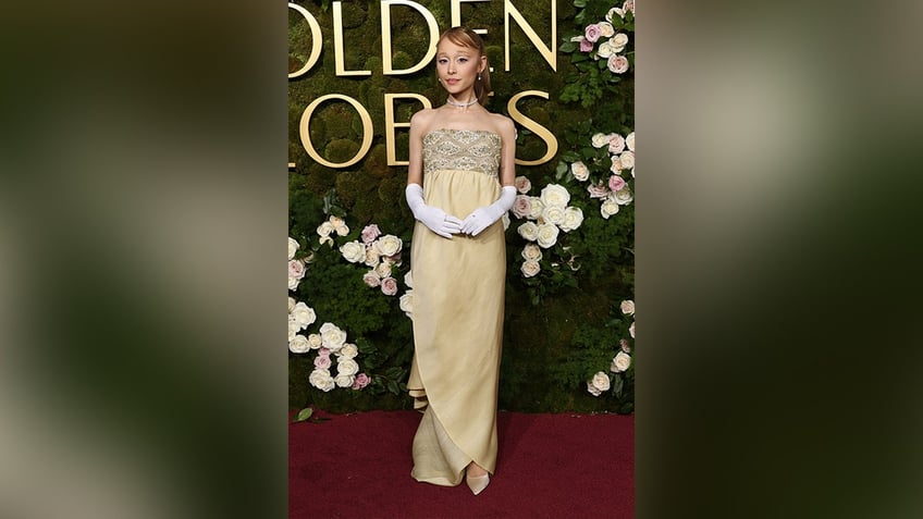 Ariana Grande wore a yellow dress in honor of the yellow brick road on the red carpet at the Golden Globes.