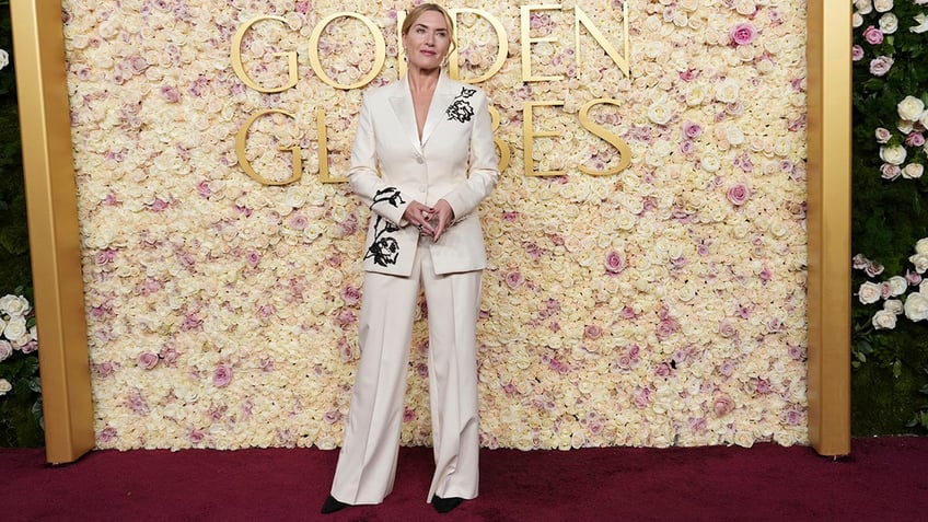 Kate Winslet walked the red carpet at the 2025 Golden Globes in a white suit with floral designs.