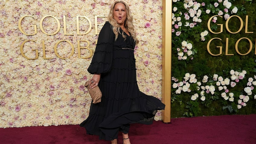 Jennifer Coolidge wore a black dress with long sleeves.