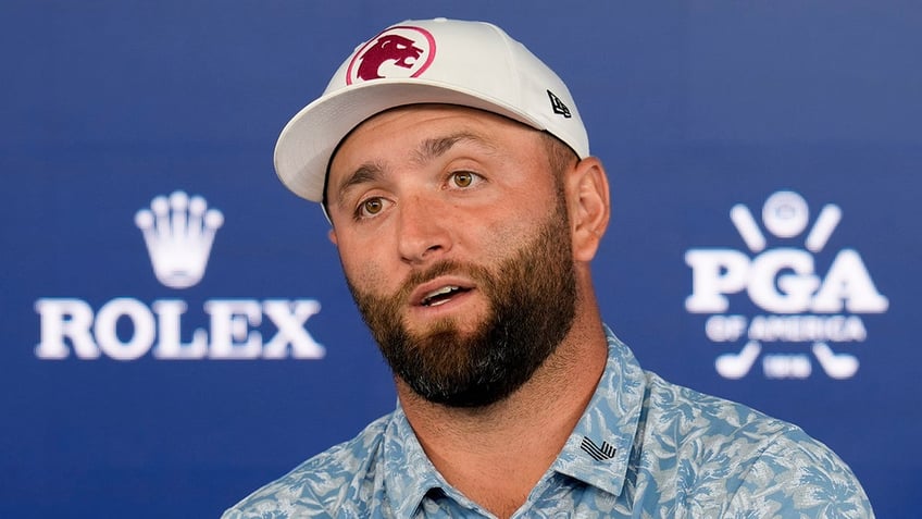 Jon Rahm talks to reporters