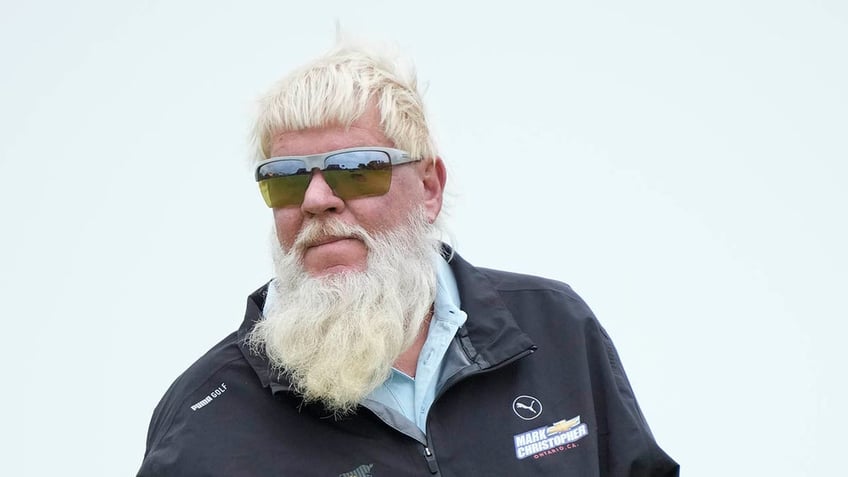 John Daly looks on