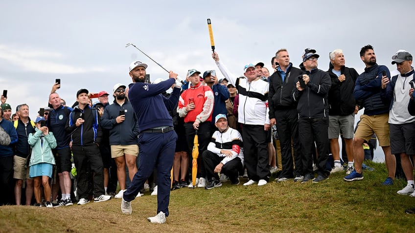 Jon Rahm plays golf