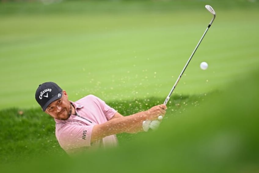 Two-time major winner Xander Schauffele of the United States plays out of bunker during a