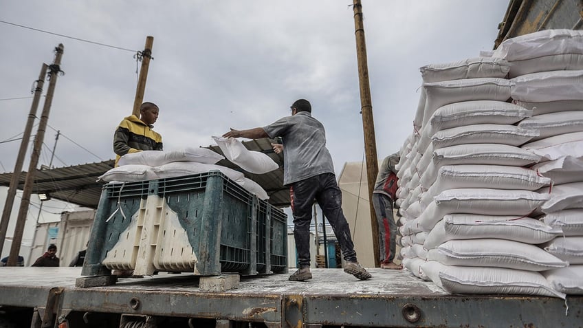 Workers distributing aid