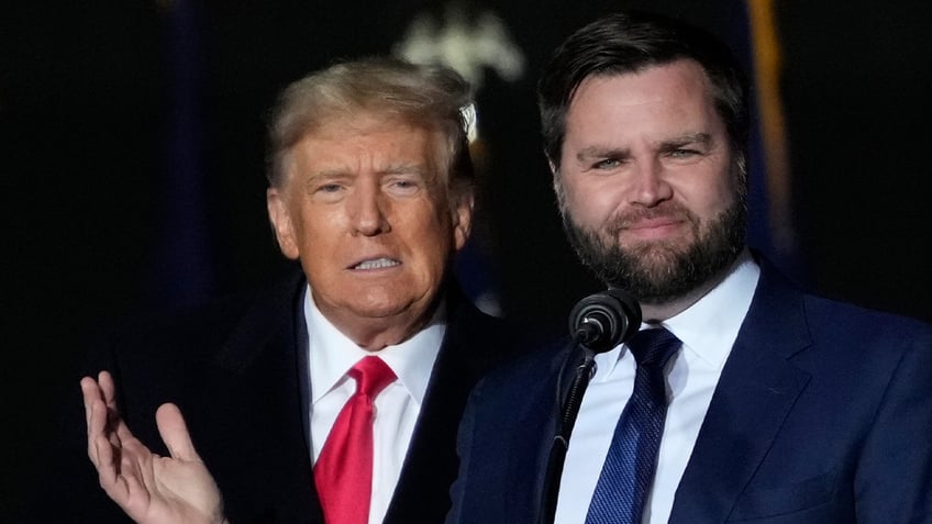 J.D. Vance in blue tie, right, with Donald Trump