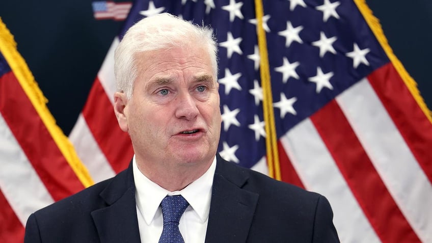 Tom Emmer speaking with US flags behind him