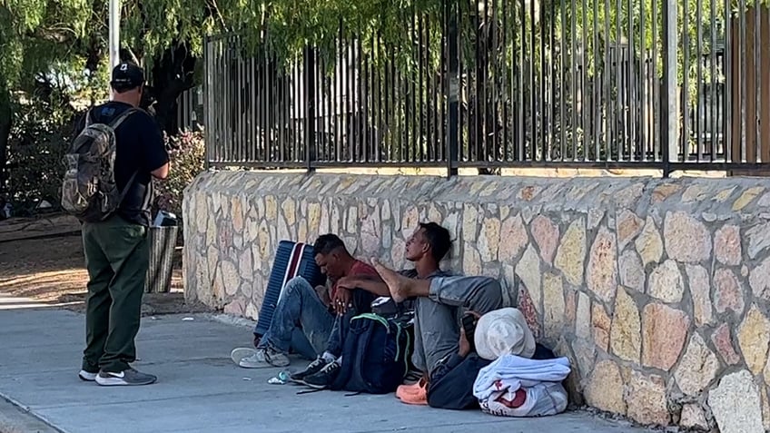 Migrants sleep on streets