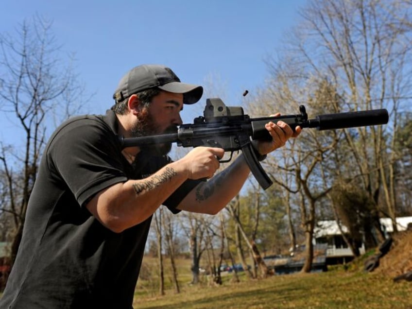 THURMONT, MD - MARCH 12: There's burst of smoke and ejecting shell as A.J. Wynne shoots a